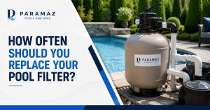 Residential swimming pool filter system beside a clear backyard pool